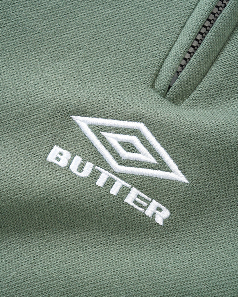 【BUTTER GOODS】X UMBRO ATHLETICA SS POLO ポロシャツ Butter x Umbro Athletica SS Polo Shirt Sage - Orchard Skateshop